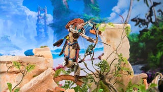 An Aloy figurine takes aim